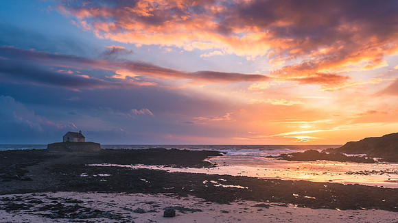 St Cwyfans Church at sunset
